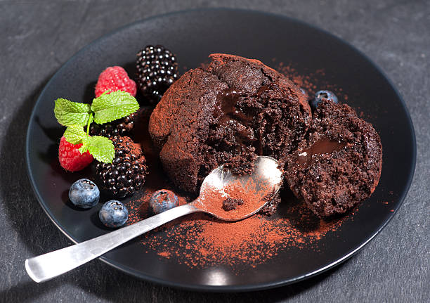 istock Chocolate muffin with chocolate cream and berries 484264878