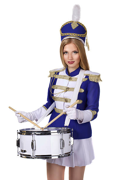 schönen blonden frau produzieren, isoliert auf weißem hintergrund - marching band stock-fotos und bilder