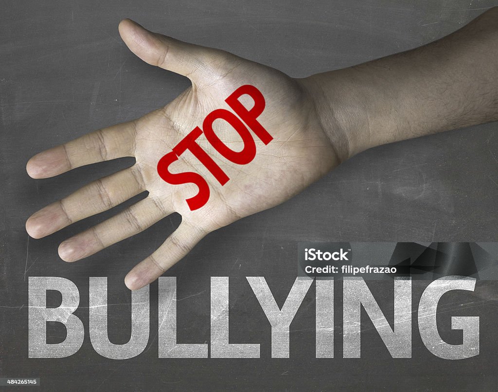 Educational and Creative composition with the message Stop Bullying Educational and Creative composition with the message Stop Bullying on the blackboard Bullying Stock Photo