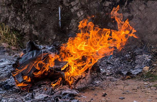 istock burning papers and box with flames and ash 484266030