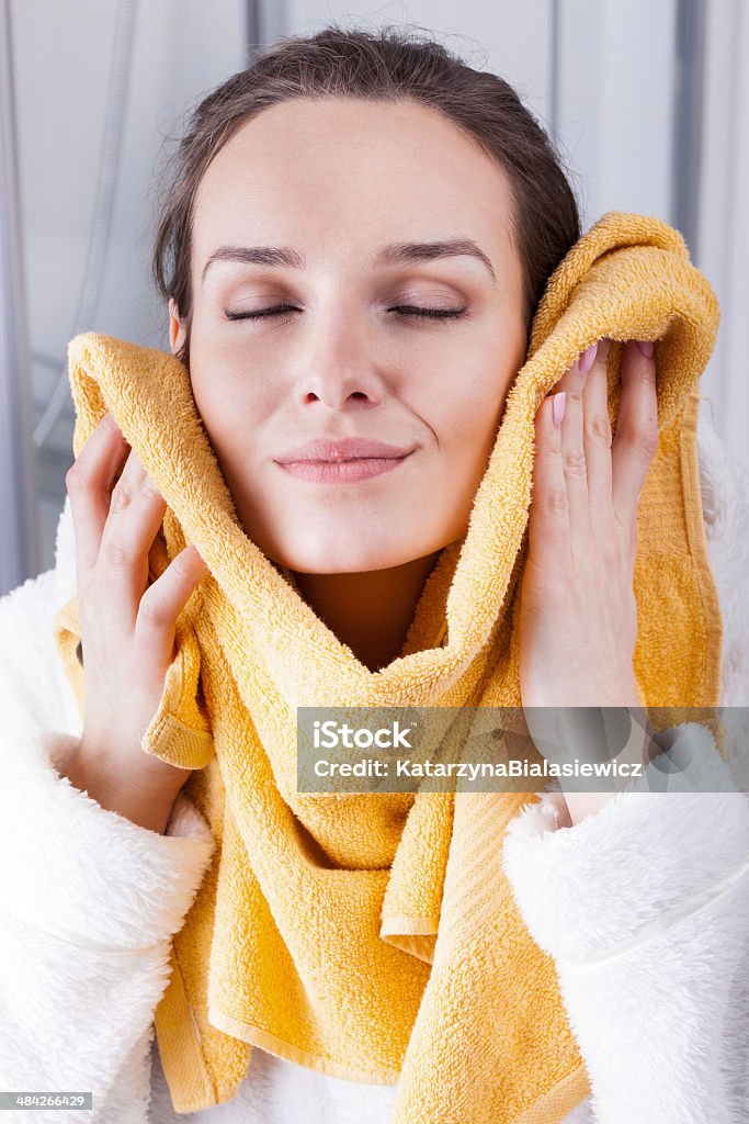 Enjoying the softness of a towel Woman enjoying the softness of a towel Adult Stock Photo