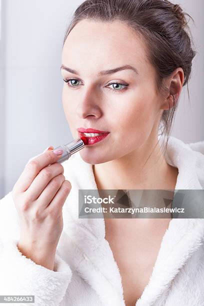 Young Woman Applying Lipstick Stock Photo - Download Image Now - Adult, Adults Only, Applying