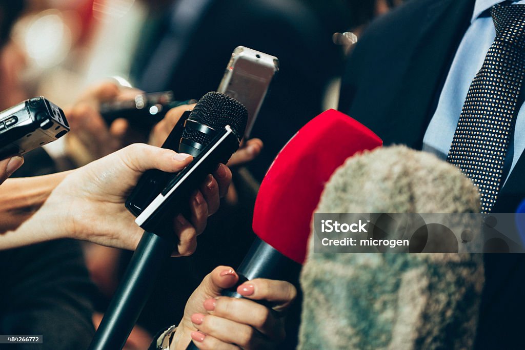 Media interview Interviewing business man on press conference The Media Stock Photo