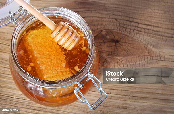 Jar Of Honey With Honeycomb And Dipper Stock Photo - Download Image Now - 2015, Brown, Dipping