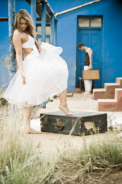 istock Young attractive caucasian couple outside blue painted building 484268461