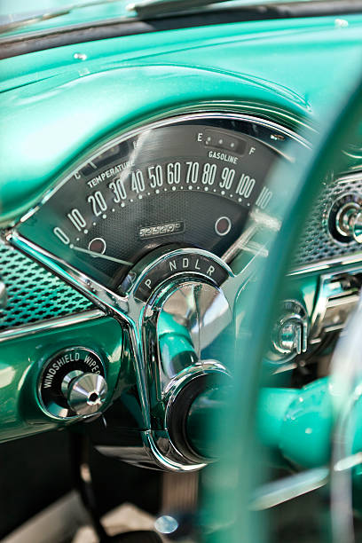 Steering wheel and dashboard of an American vintage car.