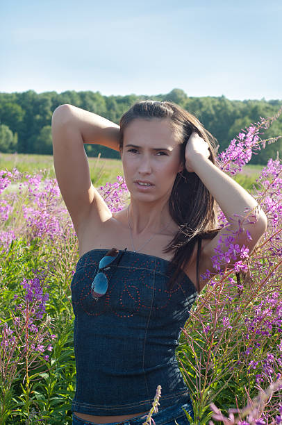 istock Beautiful brunette female in field 484268989