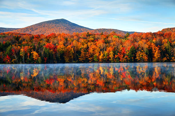 Autumn in Vermont Early morning autumn light near Killington, Vermont. Photo taken on a calm tranquil colorful morning during the peak autumn foliage season. Vermont's beautiful fall foliage ranks with the best in New England bringing out some of  the most colorful foliage in the United States pond photos stock pictures, royalty-free photos & images