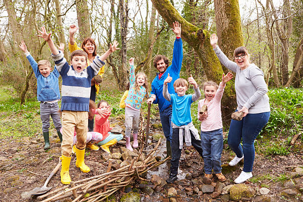 A loving family enjoys a quiet stroll together in a sunlit forest, creating lasting memories amidst nature's tranquility. The moment captures joy, connection, and the beauty of the outdoors.