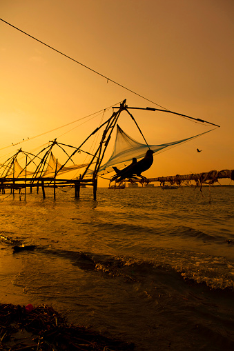 Chinese fishing nets at sunset in Fort cochin, Kerala, India.