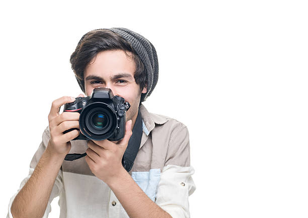 istock Portrait of smiling young man holding camera 484272078