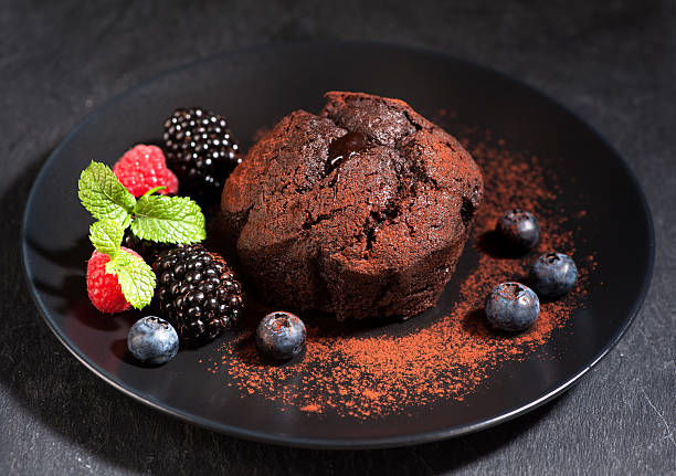 istock Chocolate muffin with chocolate cream and berries 484272740