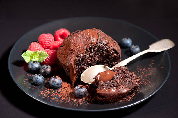 istock Chocolate muffin with chocolate cream and berries 484272766