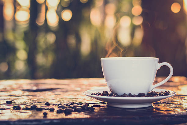 istock Hot coffee in the cup on natural bokeh background 484276820