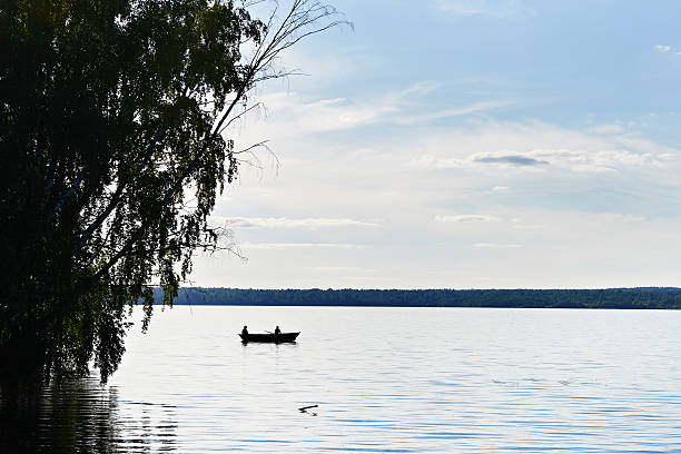 istock Evening fishing at sunset on lake 484276896