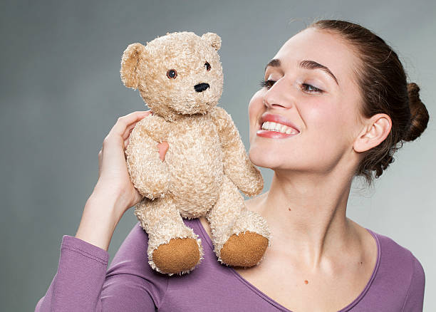 istock playful 20s girl holding her favorite comforter with emotion 484277134