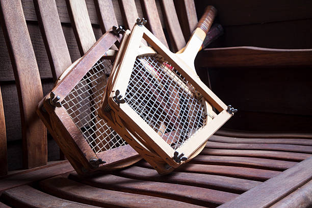 Vintage Tennis Racquets Vintage Tennis Racquets with on bench wimbledon seats stock pictures, royalty-free photos & images