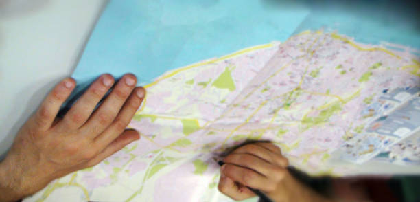istock Checking Of City Paper Map For Direction 484277666