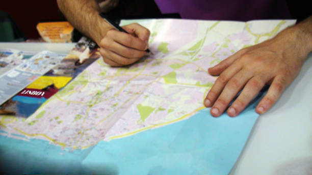 istock Young Men Checking Map While On Tour Of Lisbon Portugal 484279078