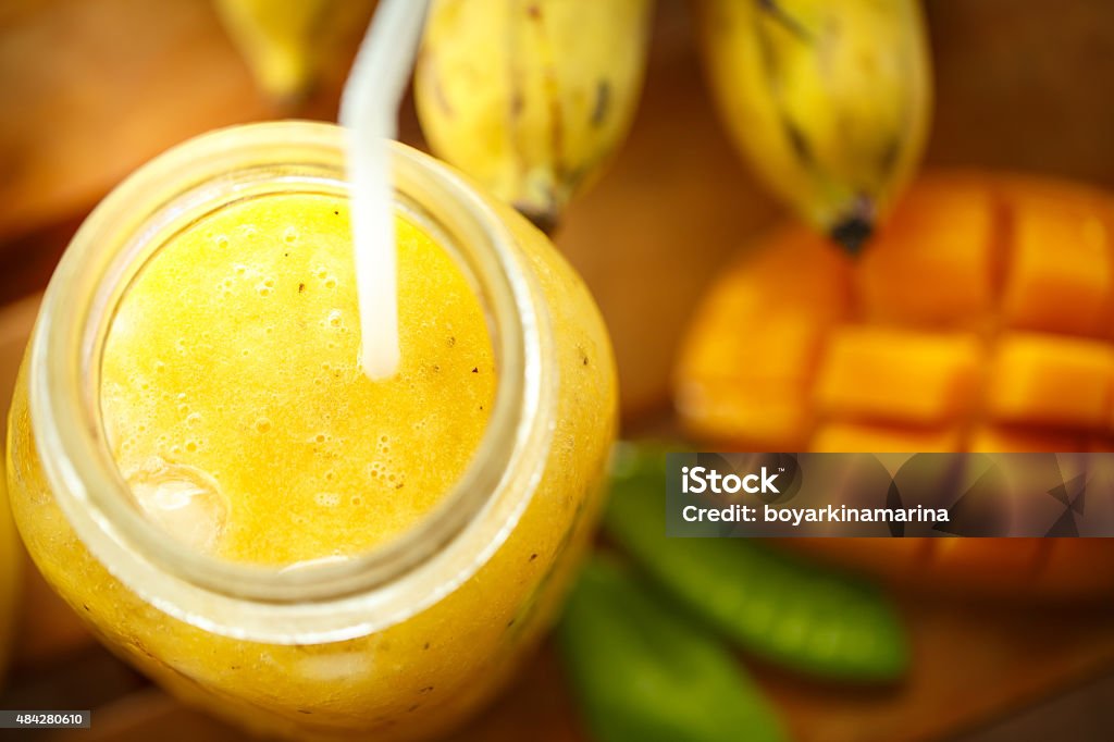 Smoothies mango and banana in a glass jar 2015 Stock Photo