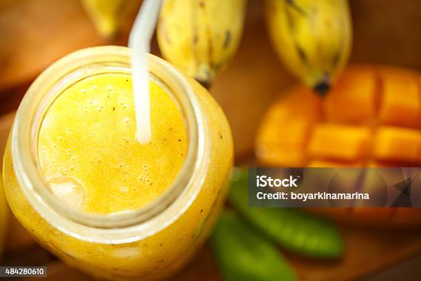 Smoothies Mango And Banana In A Glass Jar Stock Photo - Download Image Now - 2015, Backgrounds, Banana
