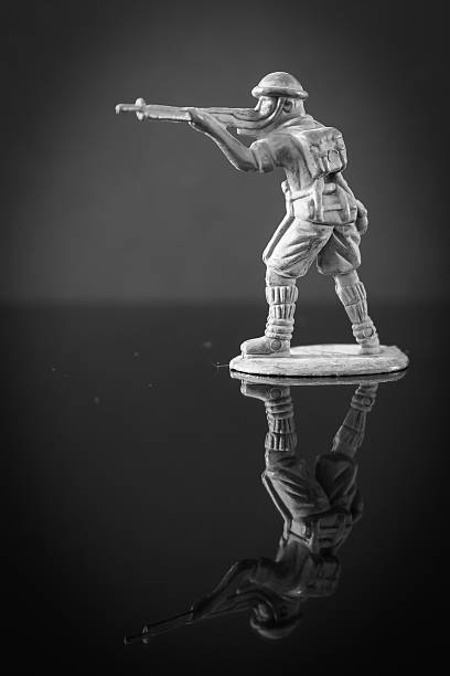 istock Mini toy soldier on black background 484283616
