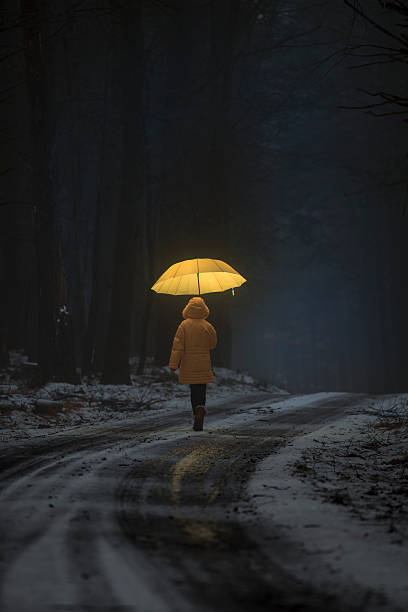 istock Little girl in the dark forest 484284498