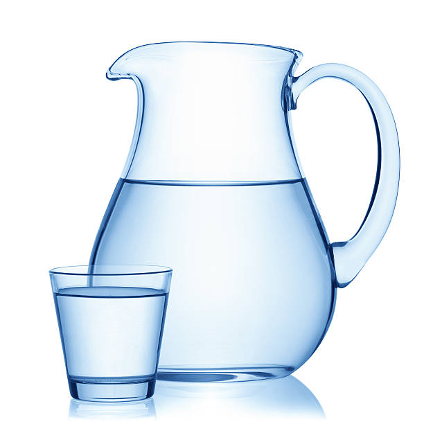 istock Pitcher and a glass of water. 484285526