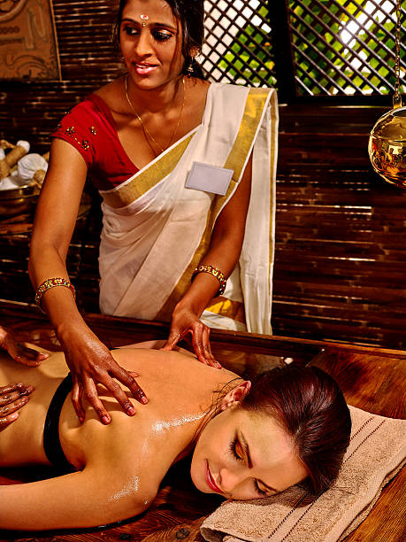 istock Woman having massage with pouch of rice 484285696