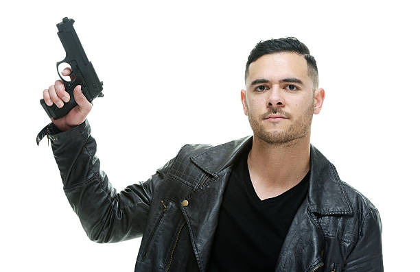 istock Casual man holding handgun 484286718