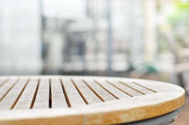 istock Round wood table top on blur background 484287594