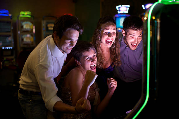 istock Friends gambling on slot machines 484288957