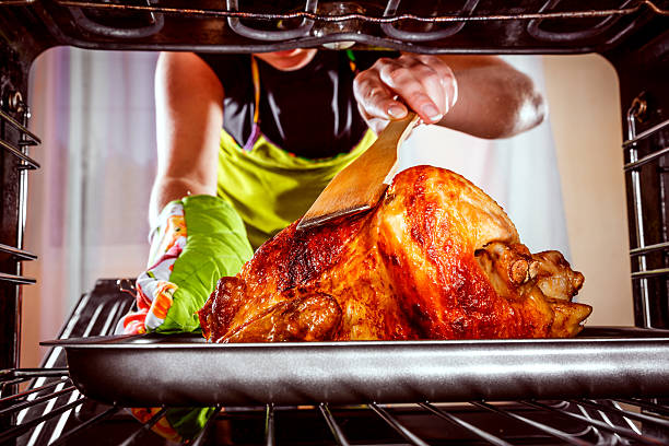 istock Cooking chicken in the oven at home. 484288982