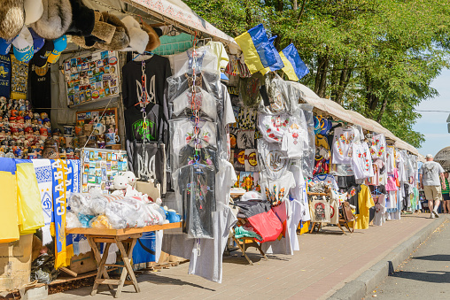 Kiev/Ukraine - July 31, 2015 - Souvenir shops in Andriyivskyy Descent. Traditional Matryoshka dolls and Ukrainian shirts are exposed