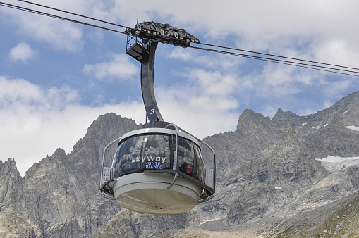 Aosta Valley, Italy - August 6, 2015: The new SkyWay aerial tramway links the city of Courmayeur with Pointe Helbronner on the top of Mont Blanc massif