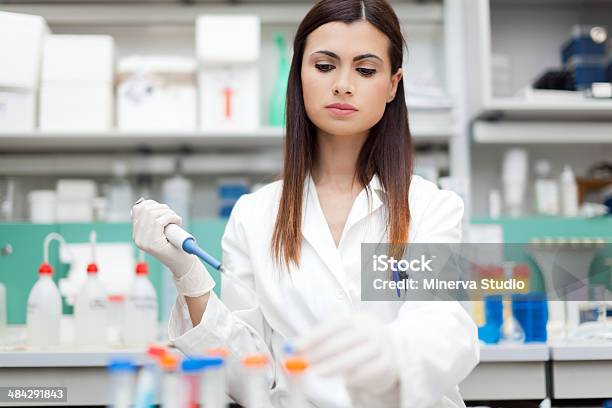 Researcher Examining A Test Tube Stock Photo - Download Image Now - Adult, Adults Only, Analyzing