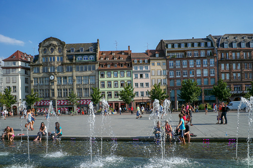 strasbourg, france - August 3, 2013: people are sitting by the pool at place kleber plaza at strasbourg france
