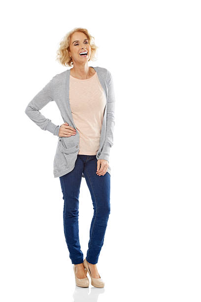 istock Cheerful mature woman standing over white background 484291997