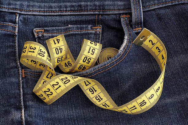 istock Jeans with tape measure in pocket 484292614