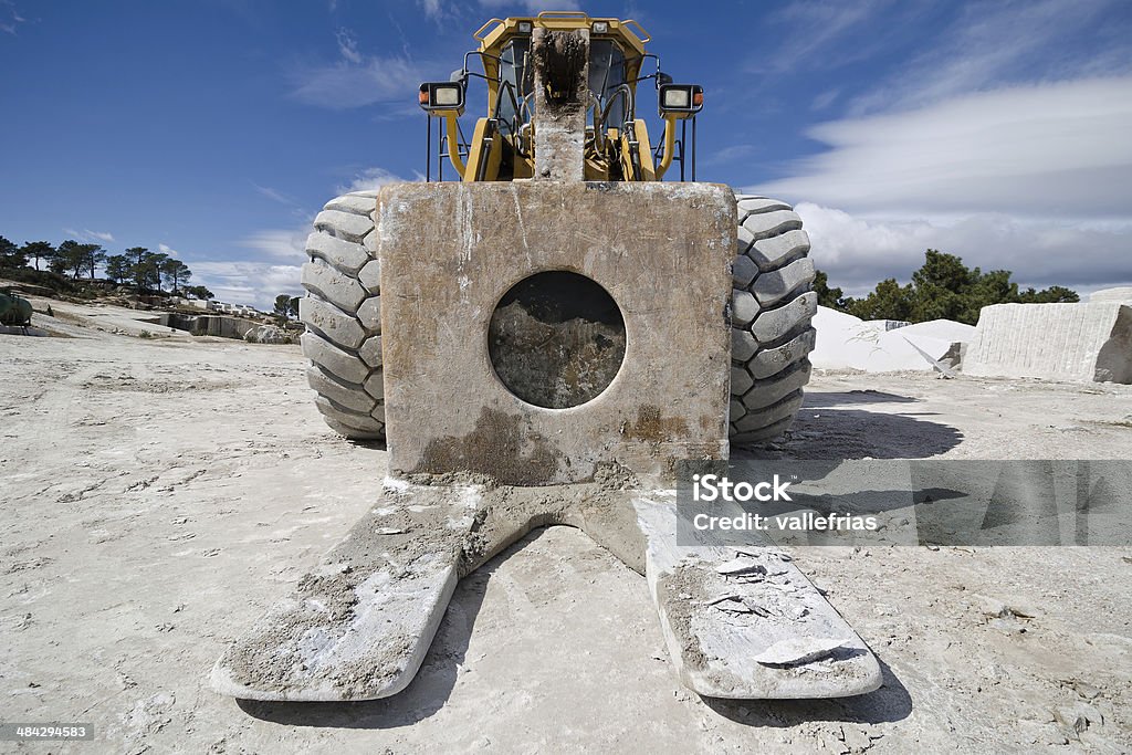 machine quarry machinery adapted to transport the stone blocks Backhoe Stock Photo