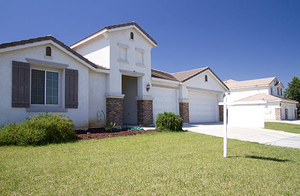 Blank Real Estate Sign in Front of New House.