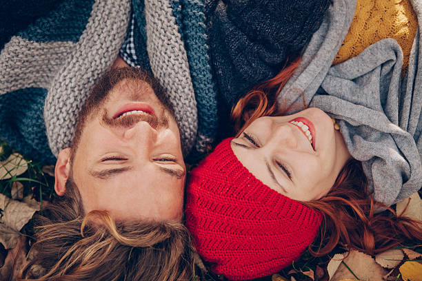 istock Young couple enjoying in park in autumn. 484297882