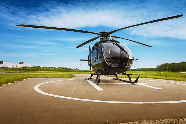 The helicopter in airfield Helicopter parked at the helipad helicopter stock pictures, royalty-free photos & images