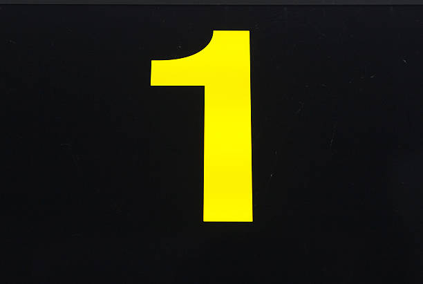 istock Gold number one on dark background 484299142