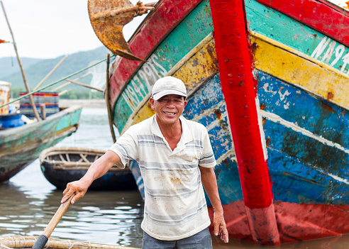 Nghe An, Viet Nam - July 18, 2015: An unidentified fisherman worked in fishing village in Vietnam