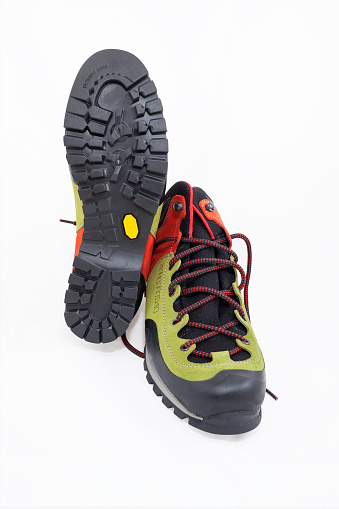 Ljubljana, Slovenia - August 3, 2015: Brand new fast approach hiking boots Joy Mid made by company Alpina with Vibram sole isolated on white background