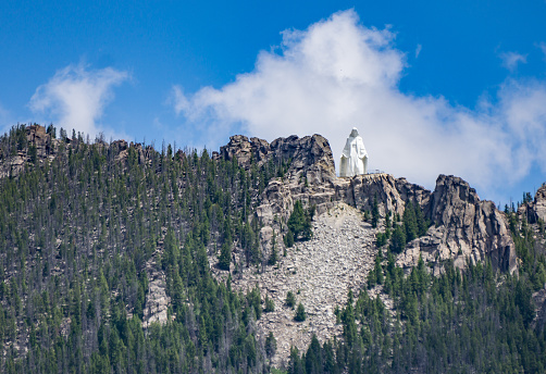 Butte, Montana, USA-July 12, 2015: Our Lady of the Rockies is a 90 foot statue on a mountain overlooking the city of Butte  and depicts the Virgin Mary. 