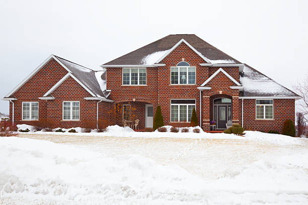 istock Red Brick Mansion House in Snowy Winter Setting 484308997