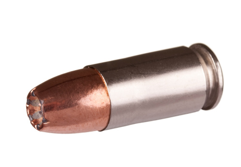 Nine Millimeter Hollow Point Bullet Full Metal Jacket close up with Clipping Path. Image shot with Canon 5D Mark2, EF 100 f2.8L IS USM lens, and studio strobes. Isolated on white background.