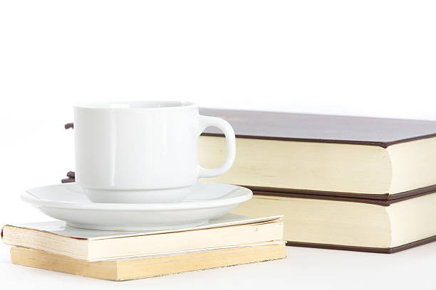 istock Composition with books and cup of coffee isolated on white 484310855